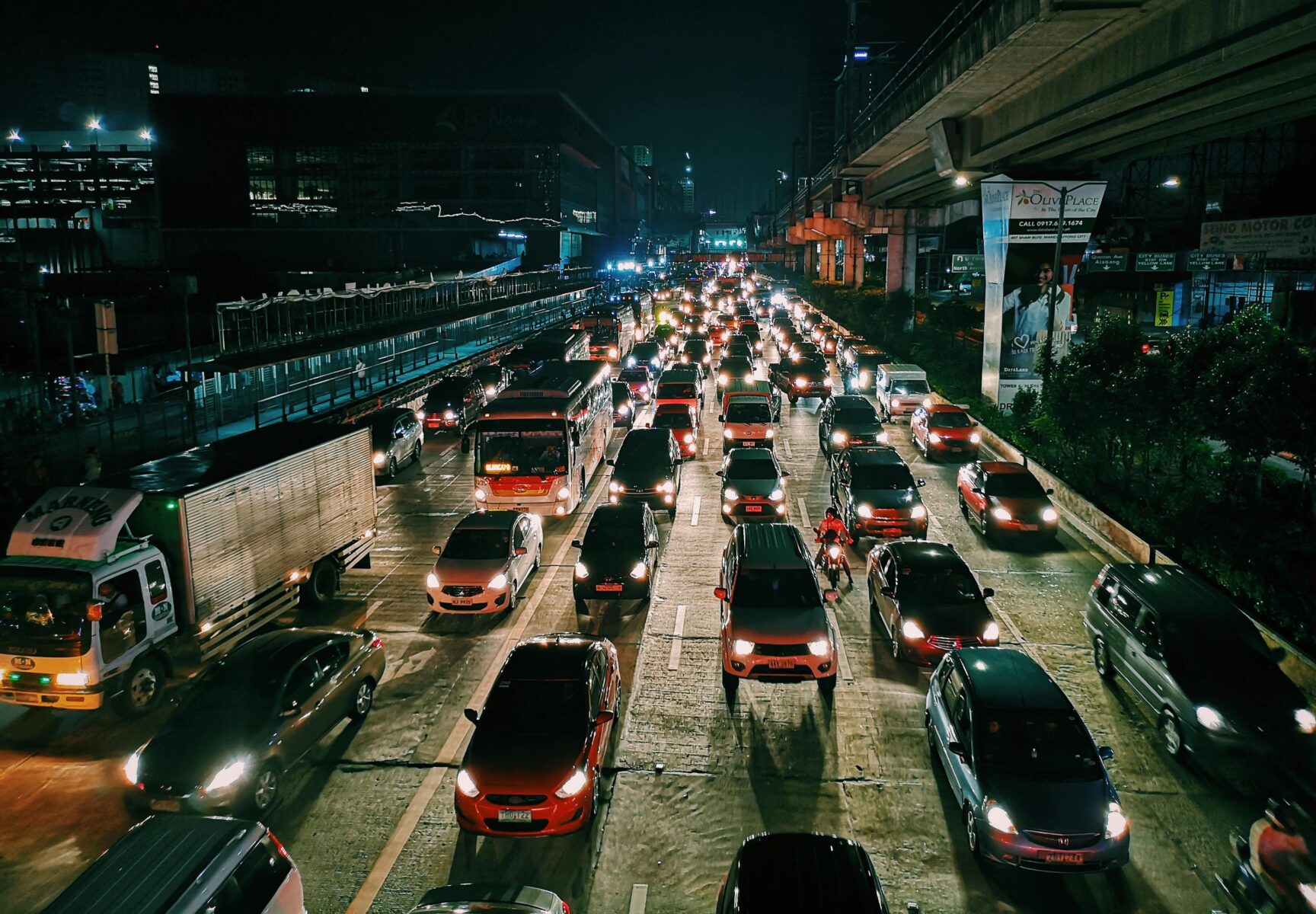 Pictures of ICE and EV vehicles at night on a crowded highway road