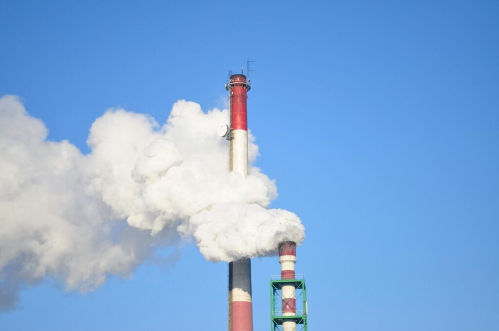 A picture of a red and black smoke stack where a continuous emission monitoring system could operate