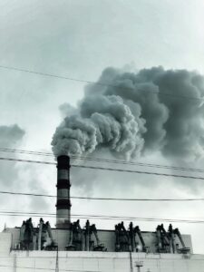 A picture of a smoke stack spewing explosive gas into the air