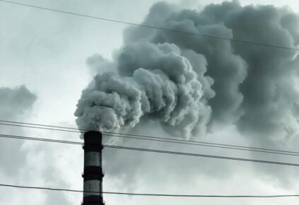 A picture of a smoke stack spewing explosive gas into the air