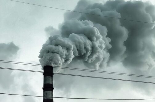 A picture of a smoke stack spewing explosive gas into the air